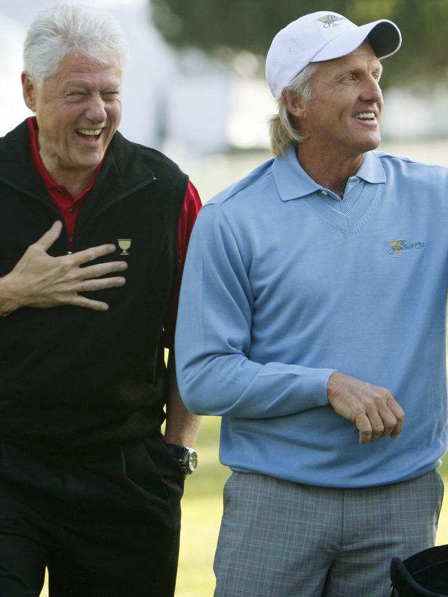 Former U.S. President Bill Clinton with Greg Norman at the Presidents Cup golf competition in 2009. Picture: AP