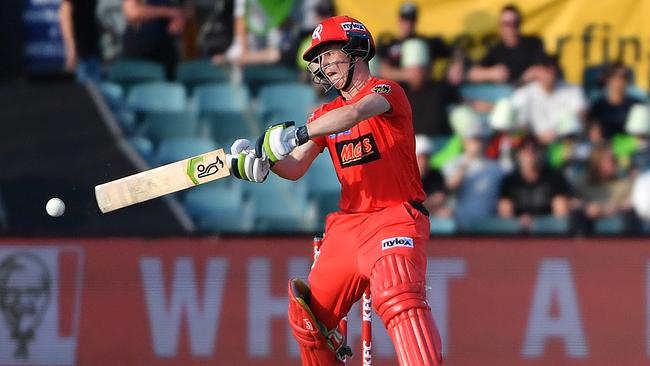 Renegades’ Sam Harper hits a boundary against the Sydney Thunder.