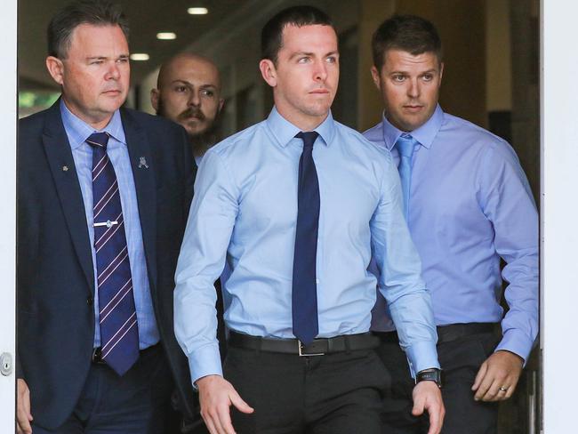 Constable Zachary Rolfe (centre) leaves the Supreme Court at Darwin during a pre-trial hearing. Picture Glenn Campbell