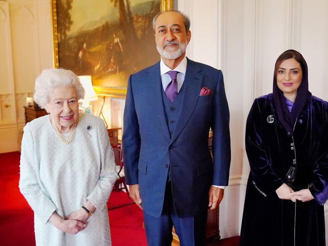 Britain's Queen Elizabeth II poses for a photograph with the Sultan of Oman and his wife during an audience at Windsor Castle where she has mostly been confined. Picture: AFP