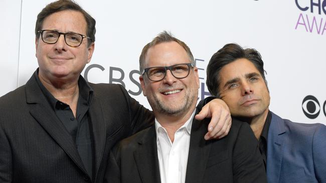 The comedian with Full House castmates and friends Dave Coulier and John Stamos. Picture: Kevork Djansezian/Getty Images
