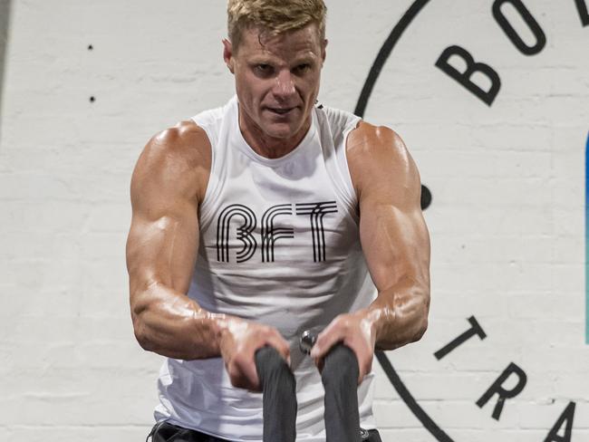 Nick Riewoldt exercises using battle ropesAustralian sports stars including former NRL players and brothers Mitch and James Aubusson, St Kilda legend Nick Riewoldt, Test captain Tim Paine and ex cricketer George Bailey are among those who have opened Body Fit Training studios. Picture: Supplied/Body Fit Training