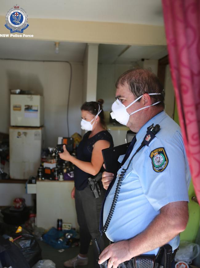 Police raid the home of a 43-year-old Scotland Island man charged over an online attempt to arrange sex with a nine-year-old girl. Picture: NSW Police