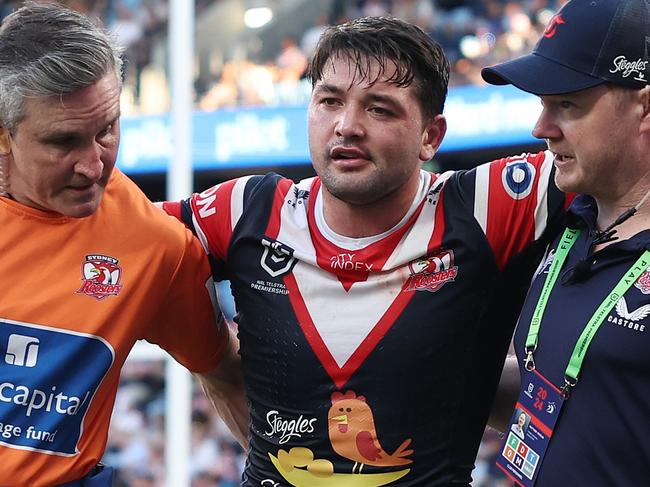 SYDNEY, AUSTRALIA - SEPTEMBER 01: Brandon Smith of the Roosters is helped off the field with an injury during the round 26 NRL match between Sydney Roosters and Canberra Raiders at Allianz Stadium, on September 01, 2024, in Sydney, Australia. (Photo by Cameron Spencer/Getty Images)