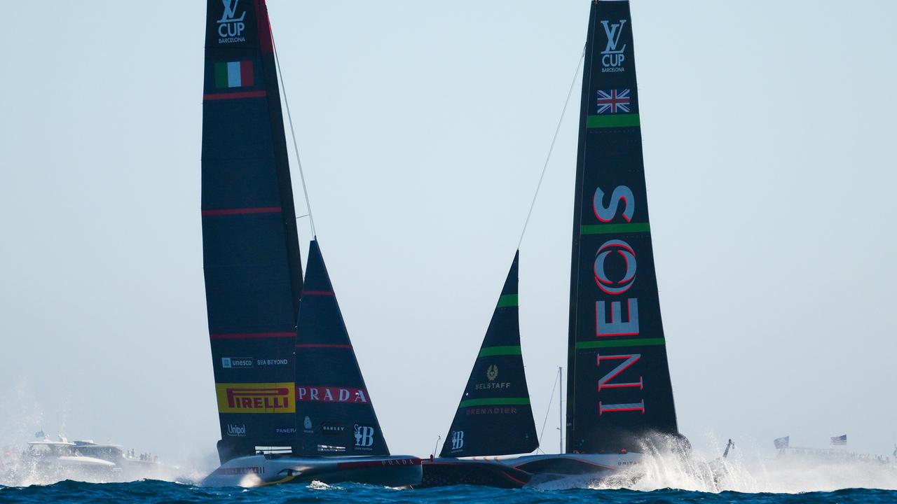 BARCELONA, SPAIN - SEPTEMBER 26: The AC75 Luna Rossa Prada Pirelli Team and the AC75 Ineos Britannia compete during the Louis Vuitton Cup Final Race 1 on September 26, 2024 in Barcelona, Spain. (Photo by David Ramos/Getty Images)