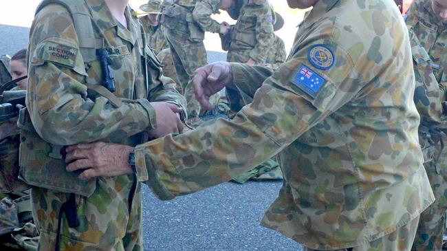 Cadet Caige Dahler and Lt(AAC) Gary Ashton checking webbing for fit and correctness. Picture: Jann Houley