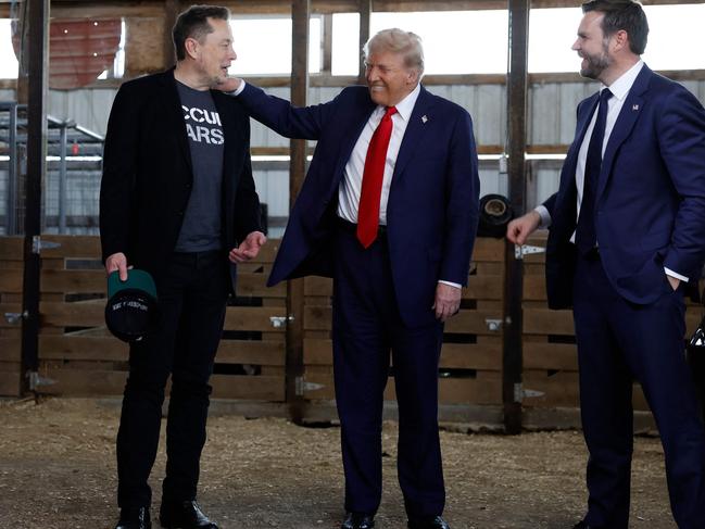 Donald Trump with Elon Musk and Senator JD Vance back stage during the campaign rally at the Butler Farm Show grounds. Picture: Getty Images via AFP