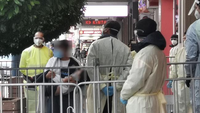 Afghan refugees, including this man and child (with their faces blurred to protect their identities), arrived in Adelaide on Wednesday morning. They will now enter 14 days quarantine at the Grand Chancellor Hotel. Picture: Trudie Glynn-Roe