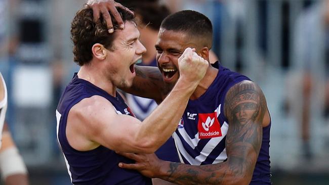 Lachie Neale celebrates a goal.