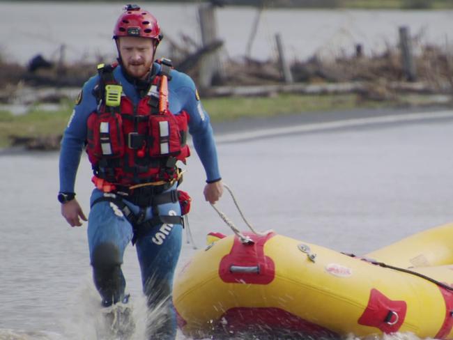 NSW SES Flood Rescue Technicians wade through flood water along Bolong Road in Shoalhaven, NSW. There has been more than 40 flood rescues across the state after wild weather battered NSW., Picture: NSW SES