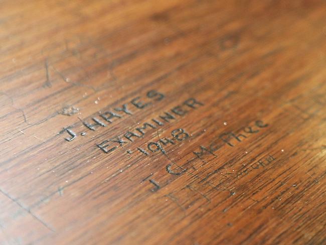 Graffiti on the media bench of the old Supreme court room. Picture: RICHARD JUPE