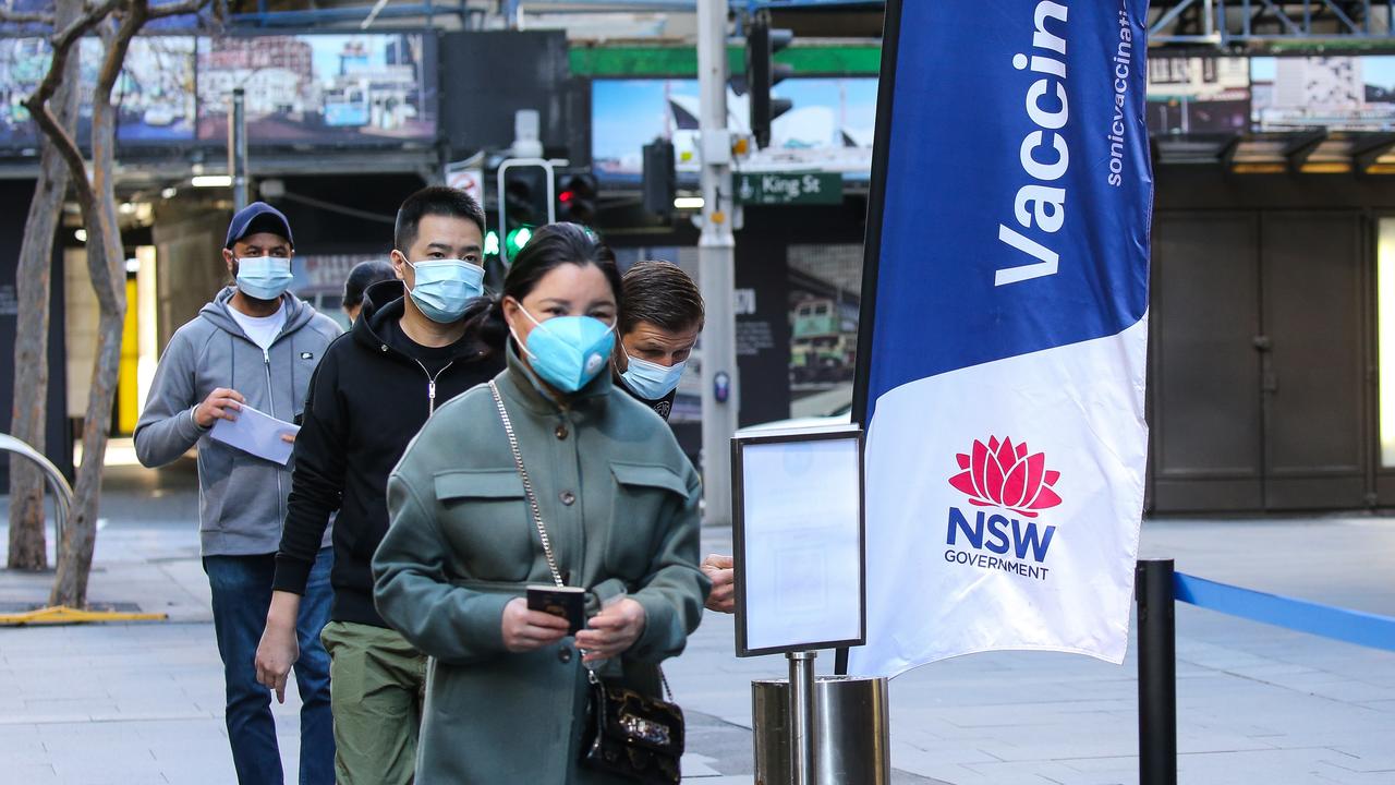 People line up to get the Covid-19 vaccine at the Vaccination Hub on Pitt Street in the CBD in Sydney on Sunday. Picture: NCA NewsWire / Gaye Gerard