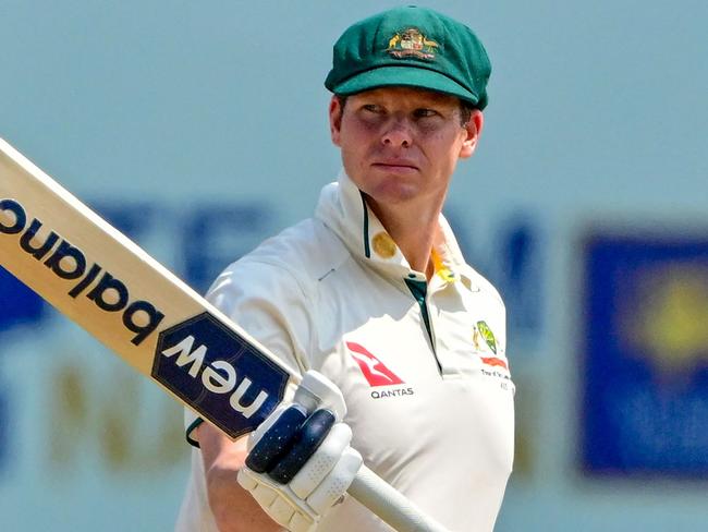 Australia's captain Steve Smith celebrates after scoring a half-century (50 runs) during the second day of second test cricket match between Australia and Sri Lanka at the Galle International Cricket Stadium in Galle on February 7, 2025. (Photo by Ishara S. KODIKARA / AFP)