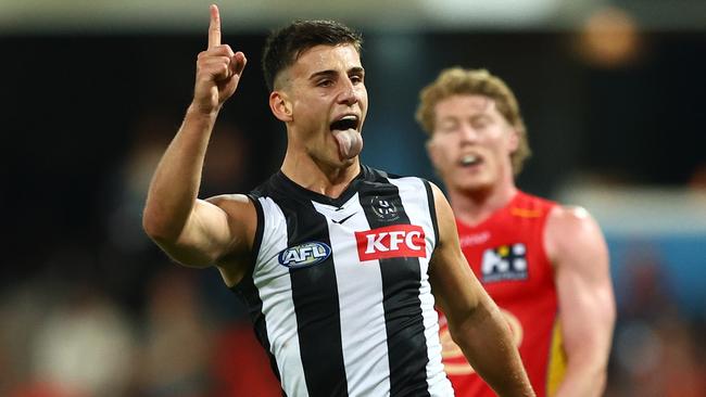 GOLD COAST, AUSTRALIA - JUNE 29: Nick Daicos of the Magpies celebrates a goal during the round 16 AFL match between Gold Coast Suns and Collingwood Magpies at People First Stadium, on June 29, 2024, in Gold Coast, Australia. (Photo by Chris Hyde/Getty Images)