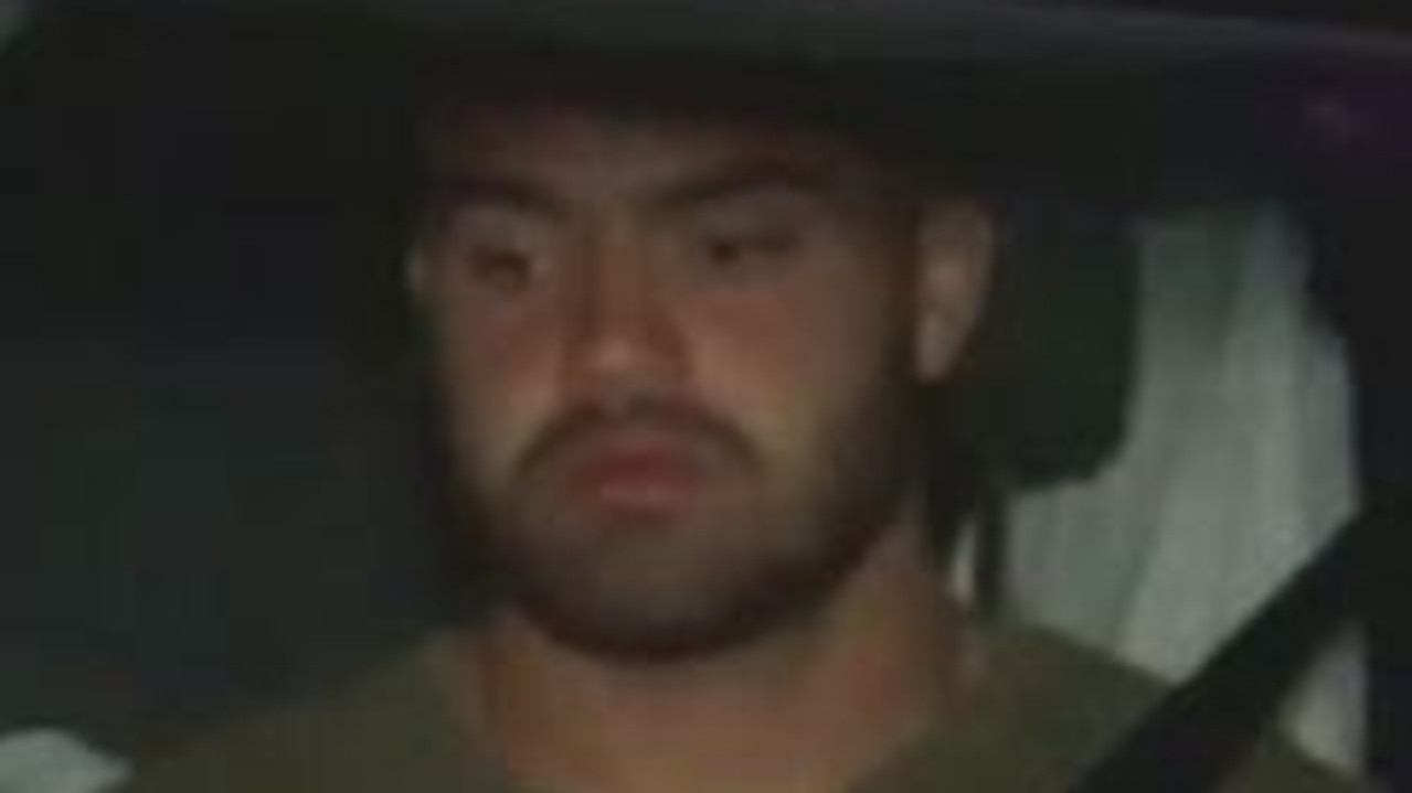 Dylan Walker is driven away after being charged over an alleged domestic incident. Picture: 9News