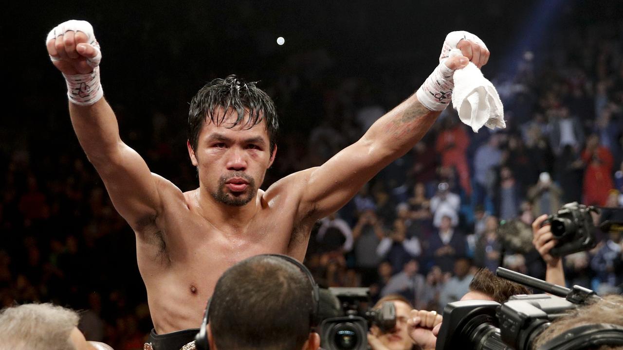 Manny Pacquiao celebrates his win against Adrien Broner in the WBA welterweight title fight.