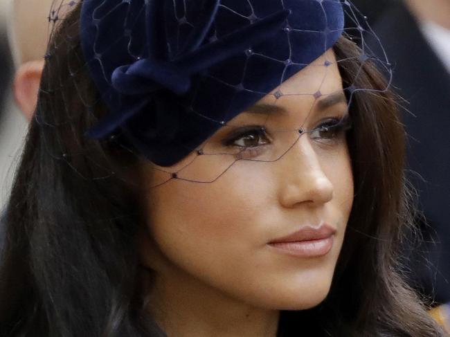 Meghan the Duchess of Sussex stands after she and her husband Britain's Prince Harry placed a Cross of Remembrance as they attend the official opening of the annual Field of Remembrance at Westminster Abbey in London, Thursday, Nov. 7, 2019. The Field of Remembrance pays tribute to all the people who have served in the British armed forces since World War I. (AP Photo/Matt Dunham)