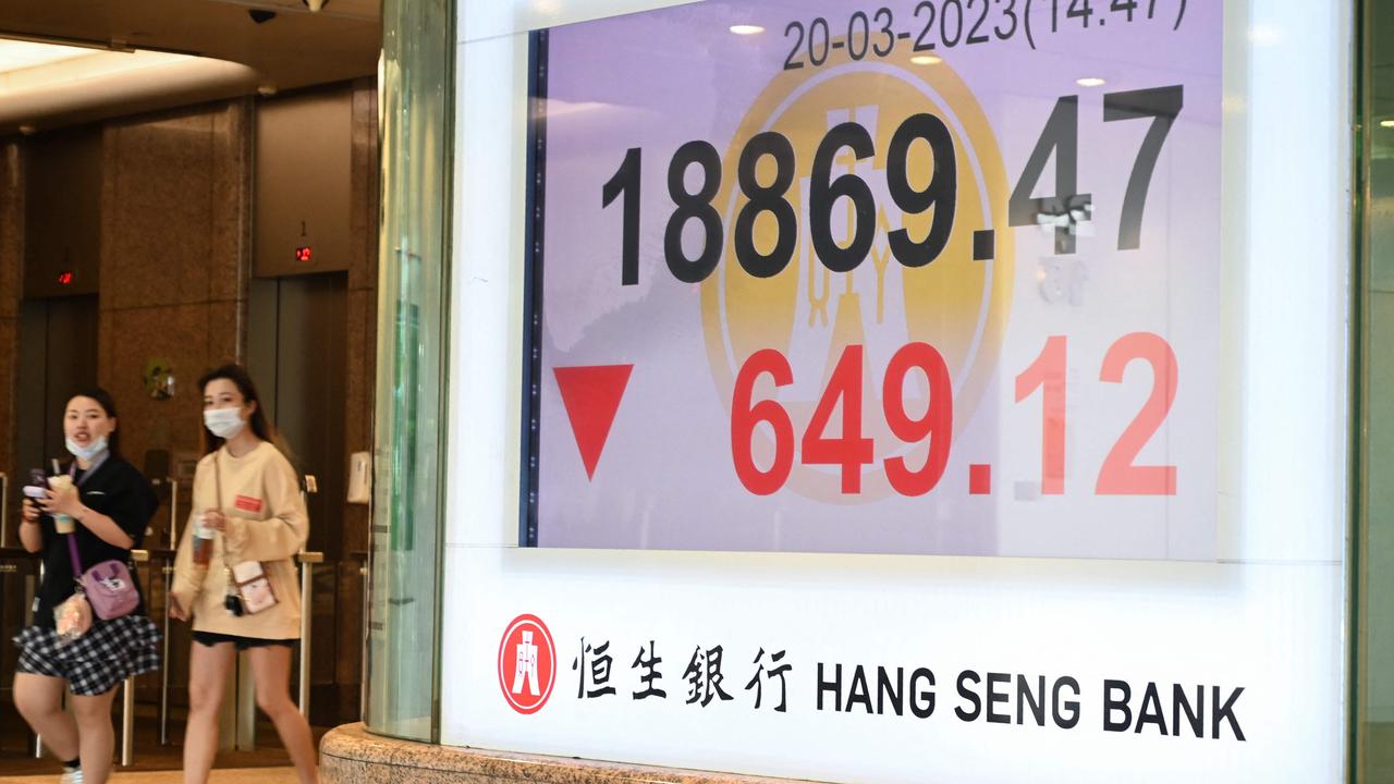 The numbers for the Hang Seng index in Hong Kong on March 20, 2023. (Photo by Peter PARKS / AFP)