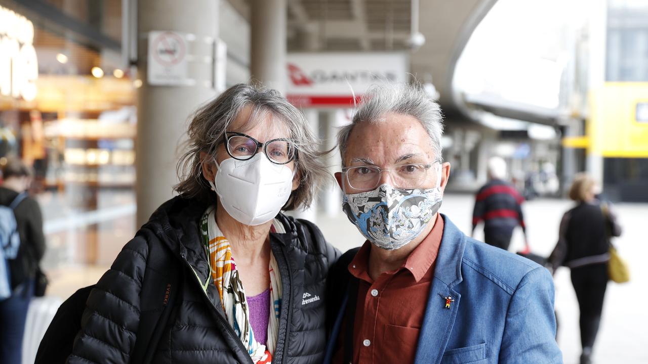 Lorraine and Greg pictured at the Brisbane Domestic Airport after arriving back from Victoria after visiting their first grandchild. They arrived before Queensland closed its border to Victoria. Photo: Josh Woning.