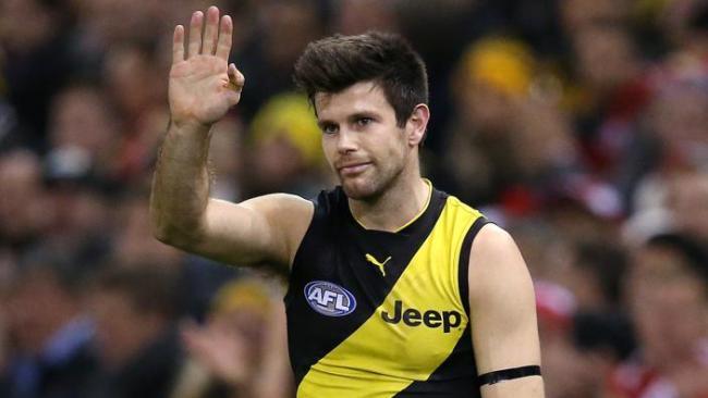 Trent Cotchin wearing a black armband.