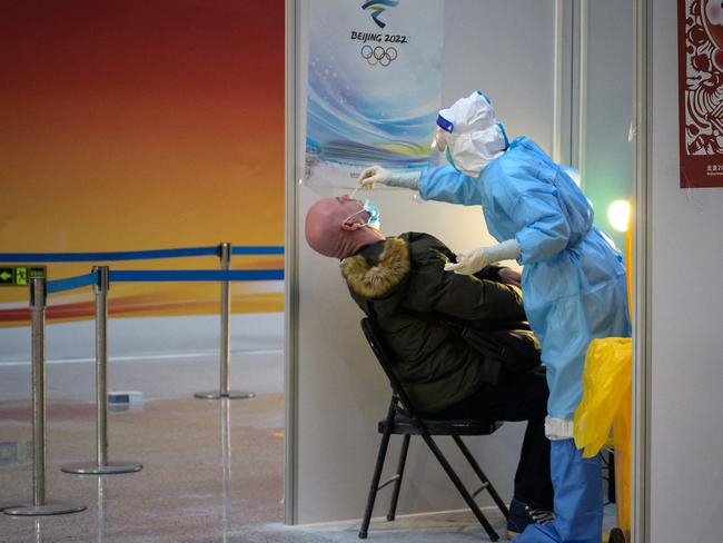 A person undergoes a Covid-19 PCR test upon his arrival at the Beijing. New smartphone-based technology could replace PCR tests. Picture: AFP