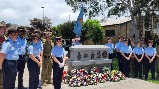 Many stood at attention during the service at Caloundra. Photo: RSL