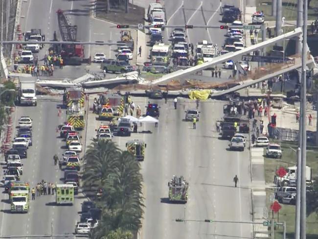 Six people were killed in the nightmare bridge collapse on Thursday afternoon local time. Picture: WPLG-TV via AP