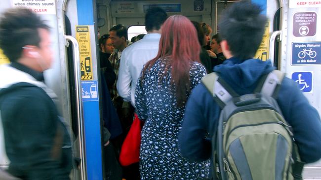 Messenger News Review 26/07/07 E14832 Crowded train story. Commuters on the Gawler line. Picture: LUKE HEMER