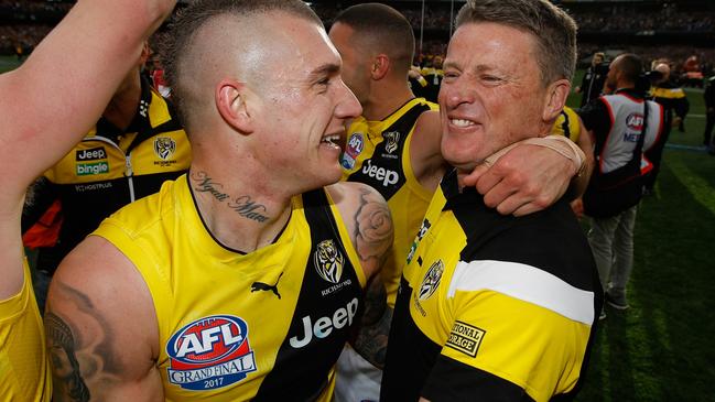 MELBOURNE, AUSTRALIA - SEPTEMBER 30: Dustin Martin of the Tigers and Damien Hardwick, Senior Coach of the Tigers celebrate during the 2017 Toyota AFL Grand Final match between the Adelaide Crows and the Richmond Tigers at the Melbourne Cricket Ground on September 30, 2017 in Melbourne, Australia. (Photo by Michael Willson/AFL Media/Getty Images)