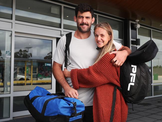 Rob with partner Paris Baker. Rob Wilkinson arrives back in Hobart after winning the Professional Fighters League light heavyweight championship in New York. Picture: Nikki Davis-Jones