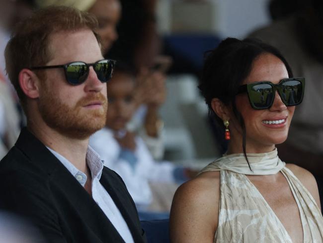 Britain's Prince Harry (L), Duke of Sussex, and Britain's Meghan (R), Duchess of Sussex, attend a charity polo game at the Ikoyi Polo Club in Lagos on May 12, 2024 as they visit Nigeria as part of celebrations of Invictus Games anniversary. (Photo by Kola Sulaimon / AFP)
