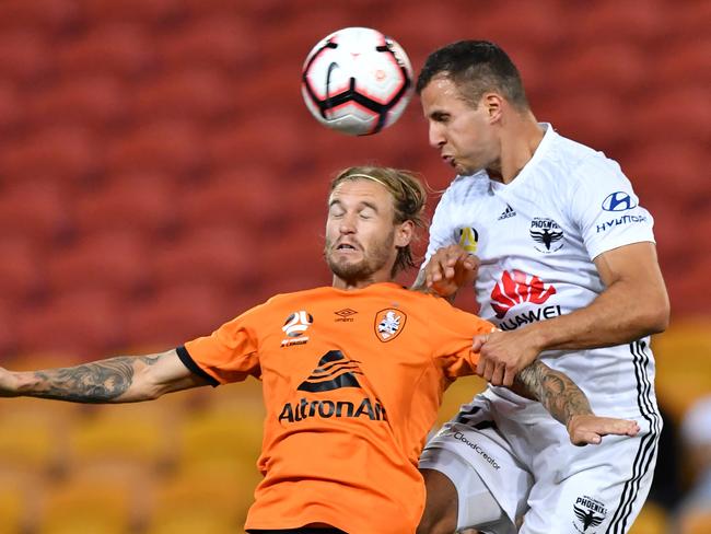 Powerful defender Steven Taylor (right) will present a challenge for Amadi-Holloway and the Roar. Picture: AAP Image/Darren England