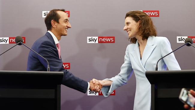 The debate opens with a handshake. Picture: Richard Dobson