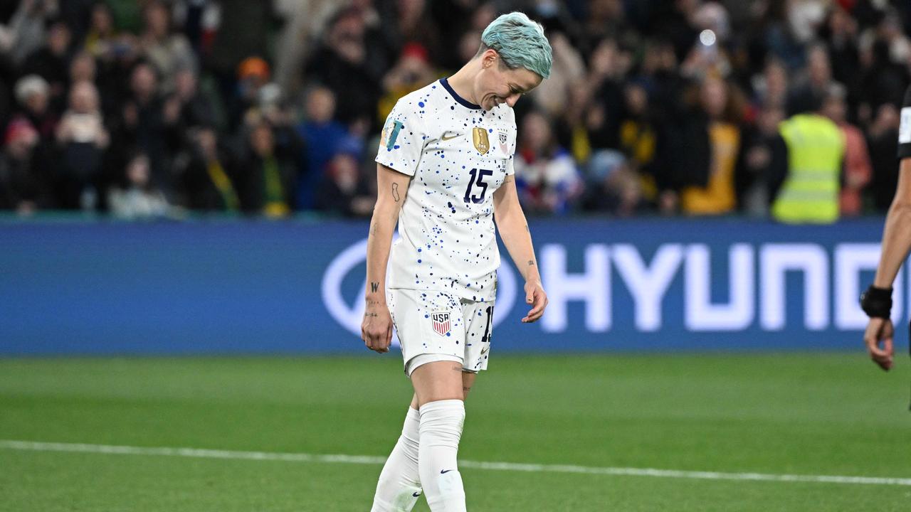 Rapinoe was seen smiling and laughing after her penalty miss. (Photo by WILLIAM WEST / AFP)