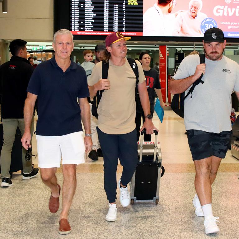 Australian golfer Cameron Smith pictured with his Australian manager Ian Davis (left) arriving home at the Brisbane Domestic Airport and bringing with him the Claret Jug from his win at The British Open. Picture: David Clark