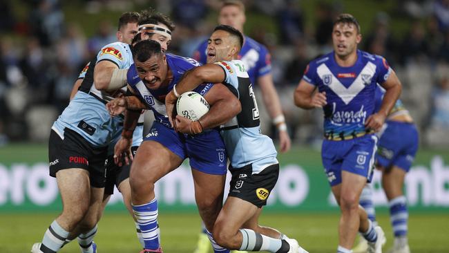 SYDNEY, AUSTRALIA – APRIL 24: Ava Seumanufagai of the Bulldogs is tackled during the round seven NRL match between the Cronulla Sharks and the Canterbury Bulldogs at Netstrata Jubilee Stadium, on April 24, 2021 in Sydney, Australia. (Photo by Jason McCawley/Getty Images)