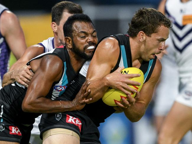 ADELAIDE, AUSTRALIA - MARCH 01:  Francis Evans of the Power protected by  Willie Rioli of the Power during the 2024 AFL Community Series match between Port Adelaide Power and Fremantle Dockers at Alberton Oval on March 01, 2024 in Adelaide, Australia. (Photo by Mark Brake/Getty Images)