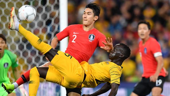 Socceroo Awer Mabil keeps an attack alive against South Korea after coming on as a substitute on Saturday night. Picture: AAP