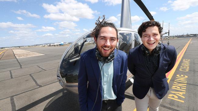 Jack Buscombe and Gauranga Magriplis with a Robinson R44 at Archerfield. Pictures: Annette Dew