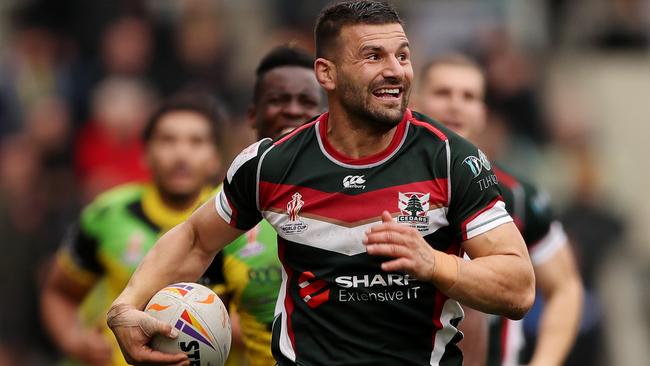 Josh Mansour races away to score a try for Lebanon. Picture: Getty Images