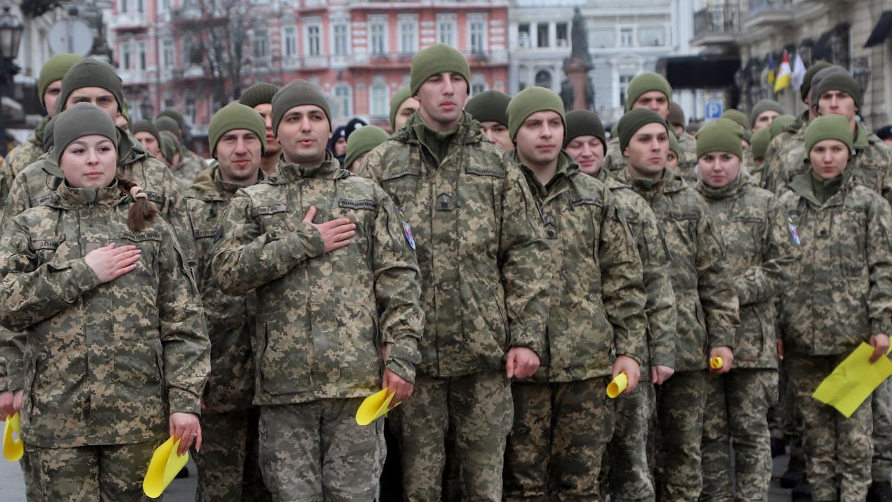 Cadets of the Odessa State University of Internal Affairs, the Military Academy of Odessa and the Institute of the Naval Forces of Ukraine, form the coat of arms of Ukraine to show unity as the threat of invasion looms. Picture: Oleksandr Gimanov/AFP