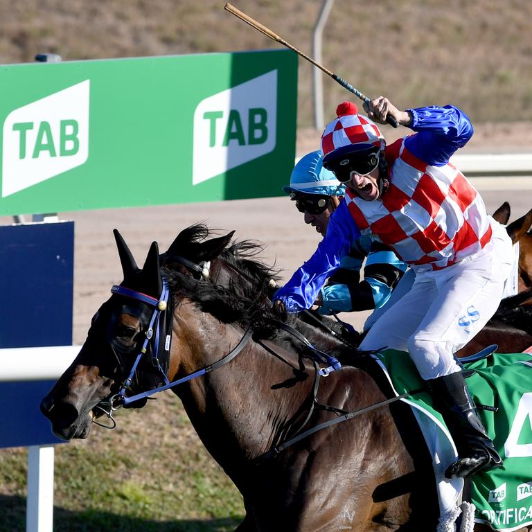 Jockey Scott Sheargold wins the 2021 Townsville Cup on Fortification. Picture: Evan Morgan