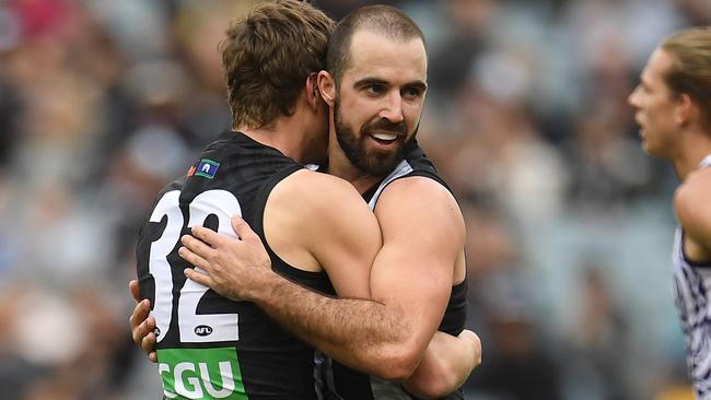 Will Hoskin-Elliot and Steele Sidebottom celebrate a goal for the Magpies. Picture: AAP Images