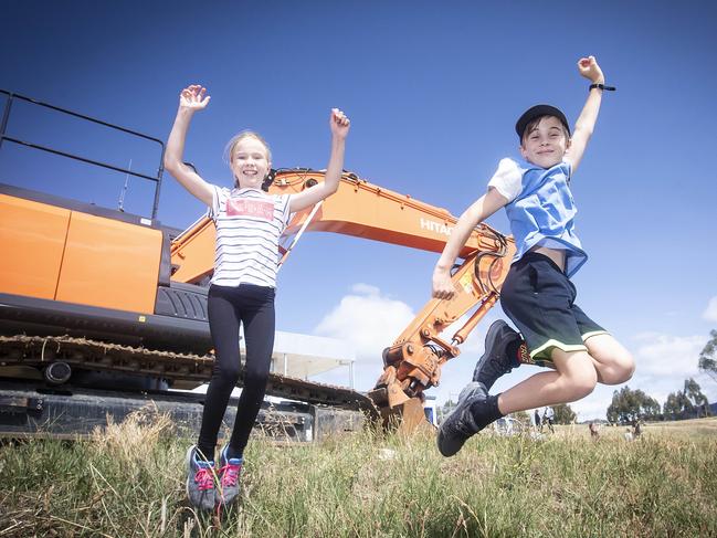 Twins, Emelia and Finlay Westwood of Blackmans Bay excited about the beginning of construction of a new playground at Kingston. Picture: LUKE BOWDEN