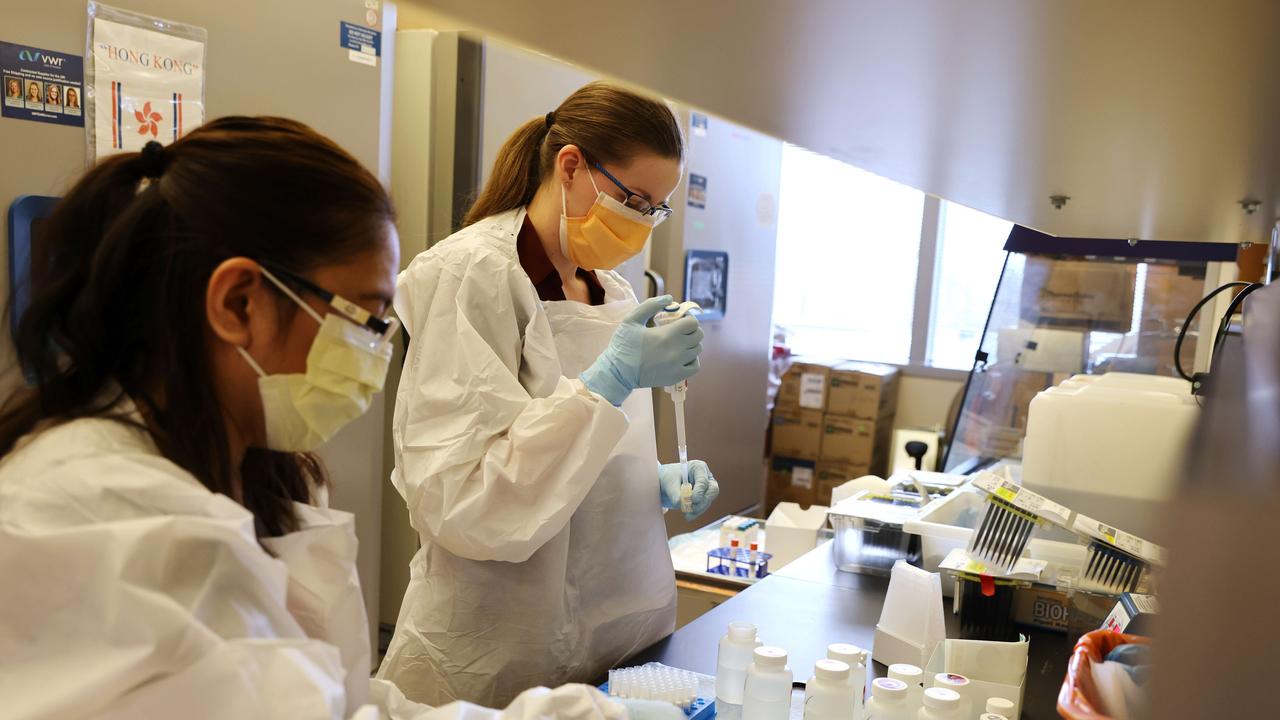 Medical lab scientists work on samples collected in the Novavax phase 3 Covid-19 clinical vaccine trial in Seattle, Washington last year. Picture: Karen Ducey/Getty Images/AFP