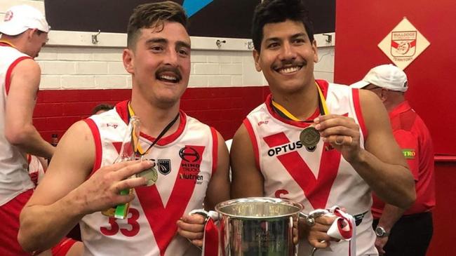 Winners are grinners ... Ben Rioli with South Fremantle teammate Jason Maskos and the WAFL's premiership cup.