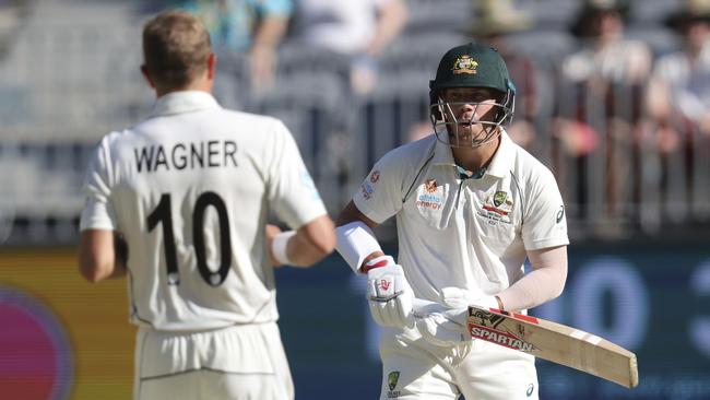 New Zealand's Neil Wagner, left, and Australia's David Warner face off after a short ball barrage in Perth