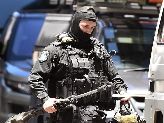 A police sniper walks to his vehicle during the Sydney siege. Picture: William West/AFP