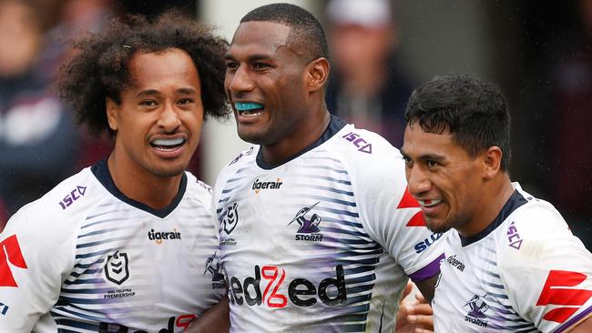 Suliasi Vunivalu of the Storm celebrates scoring a try with team mates Marion Seve and Felise Kaufusi during the Round One NRL match between Manly Sea Eagles and Melbourne Storm at Brookvale Oval in Sydney, Sunday, March 15, 2020. (AAP Image/Brendon Thorne) NO ARCHIVING, EDITORIAL USE ONLY