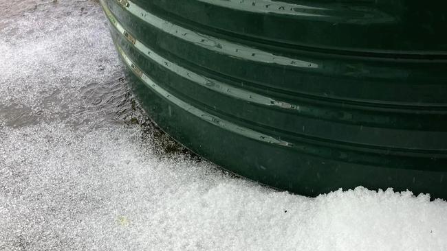 Cambooya resident Garry Greer recorded small hail in his backyard after a heavy downpour on Tuesday afternoon. Photo: Garry Greer/Facebook